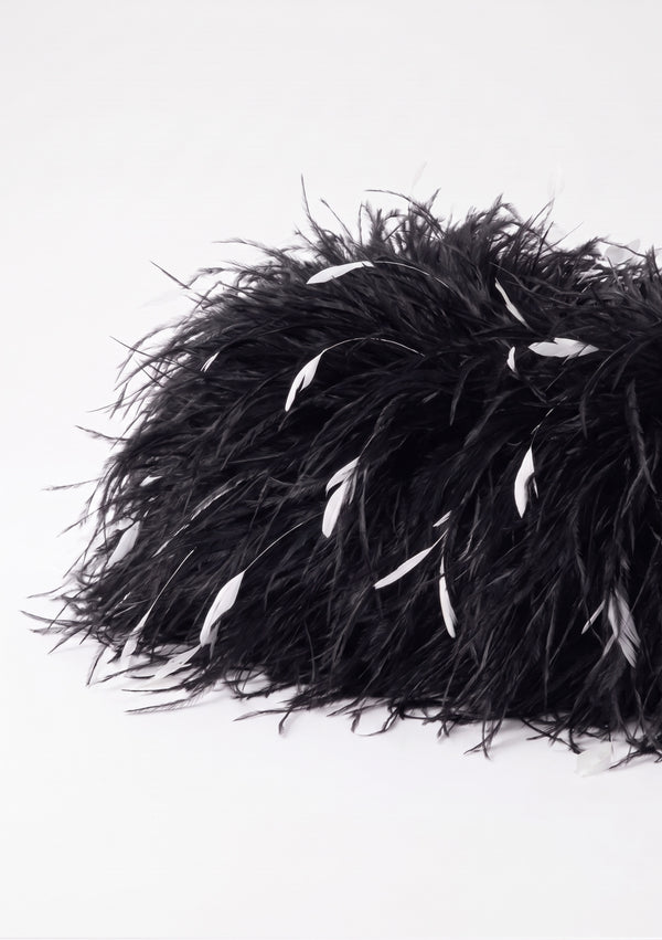 Side view of the Black Feather Bag in black ostrich feathers with white flecks.