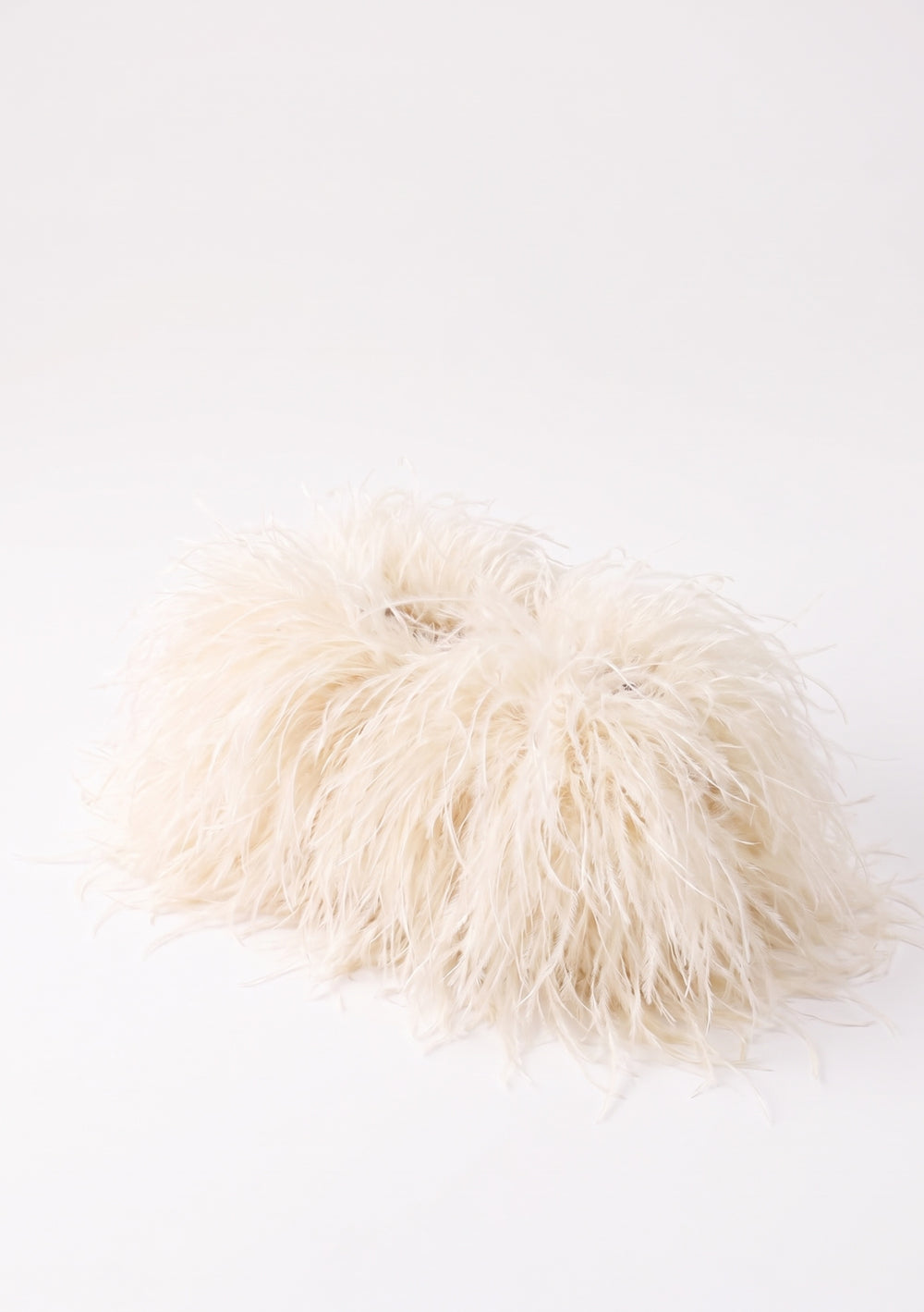 Milk Feather Bag open: cream ostrich feather clutch with a frame and cream lining with the La Musa label.