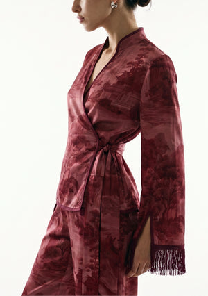 Crimson Dusk Set detail, satin sash knotted at the side waist of the burgundy wrap top with the wrist slit and silk fringe cuff in view