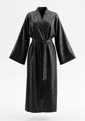 Tenebrae Robe on an invisible mannequin, black satin jacquard wrap robe with wide sleeves and a long sash finished in fringe