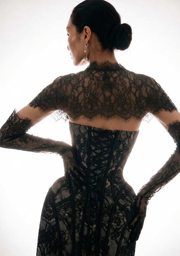 Eclipse Dress back view on-model, close on the corset lace-up back and black floral lace over grey satin