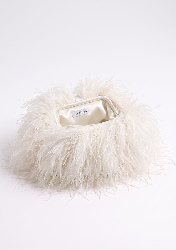 Milk Feather Bag open: cream ostrich feather clutch with a frame and cream lining with the La Musa label.
