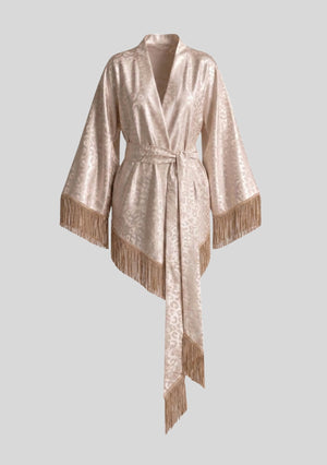 Feline robe shown on an invisible mannequin, wide sleeves and asymmetric hem both edged in fringe, sash hanging with fringed ends