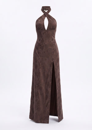 Rhiannon maxi dress shown on an invisible mannequin, crossover halter straps rising to a buckled collar, seam under the bust and the slit running to the hip