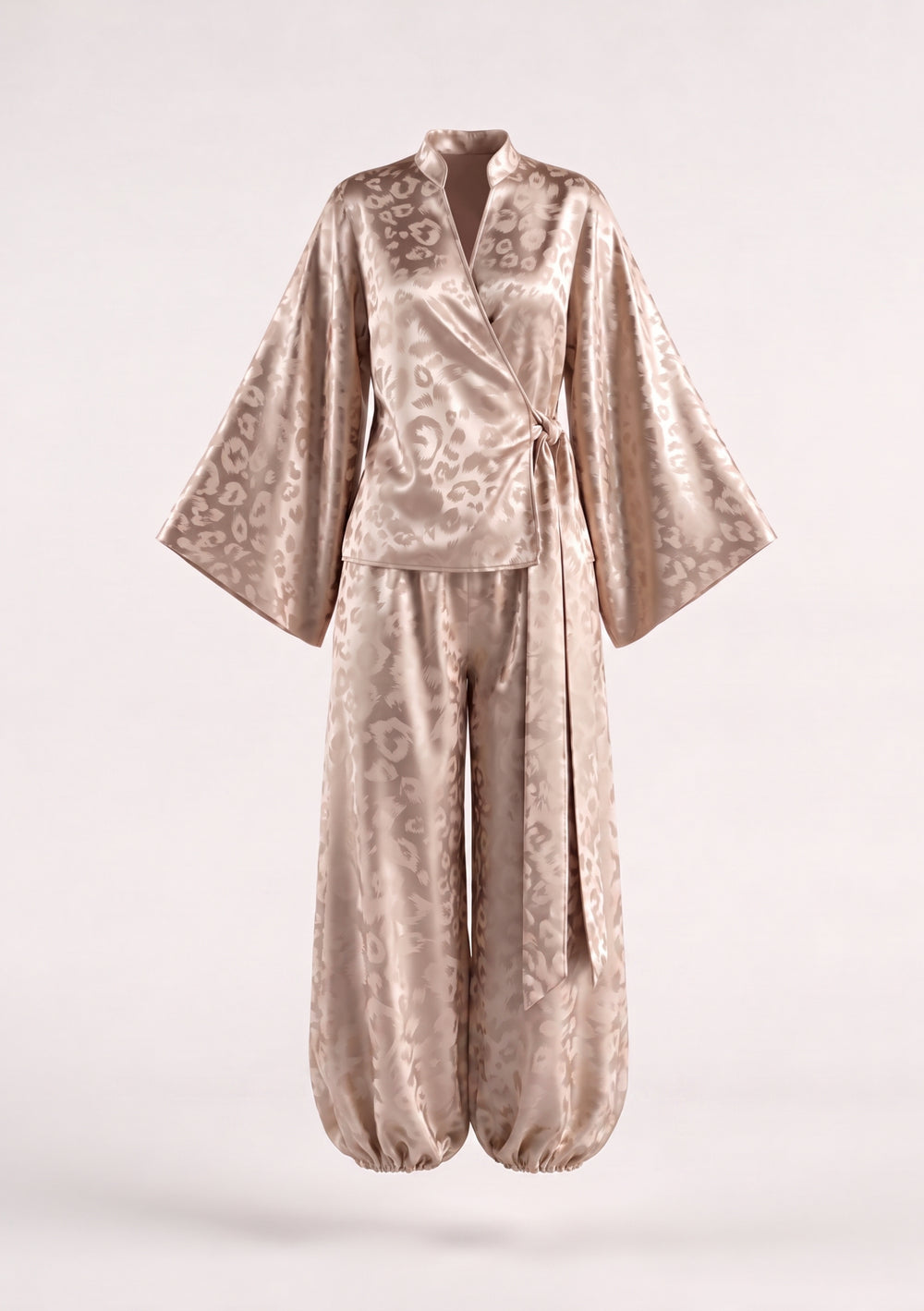Feline beige leopard jacquard set on model, wrap shirt tied at the side over trousers gathered at the ankle