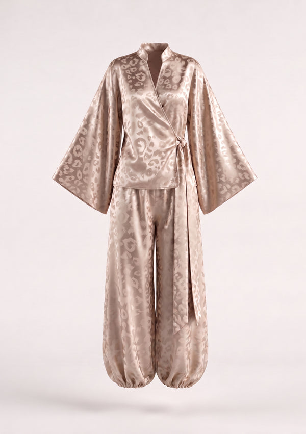 Feline set shown on an invisible mannequin, wrap shirt with wide bell sleeves above the matching cuffed trousers