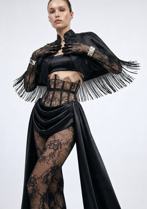 Black satin Baccara skirt and lace corset waist styled with the fringe Baccara Cape, cropped view