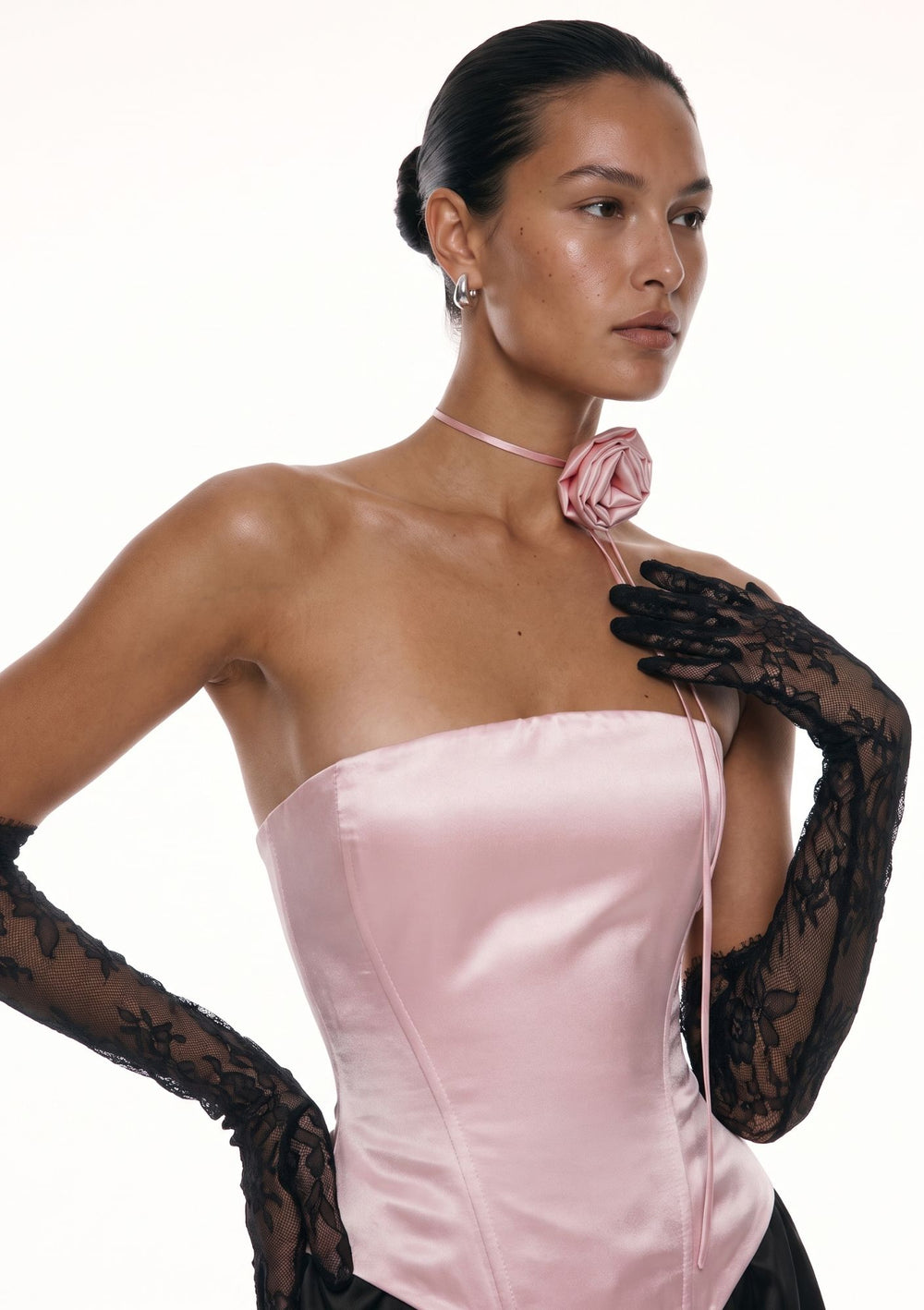 Pink satin Marshmellow strapless corset with rose tie choker, close up front view with black lace gloves
