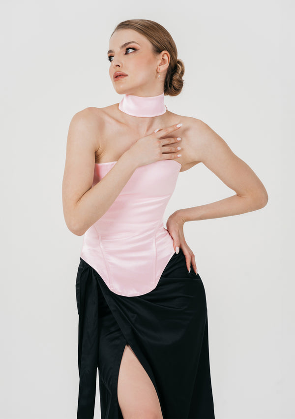 Pink satin Marshmellow corset with satin band choker styled over a black wrap skirt with high slit