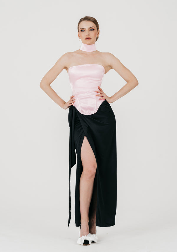Full length view of pink satin Marshmellow corset with satin band choker and black slit maxi skirt
