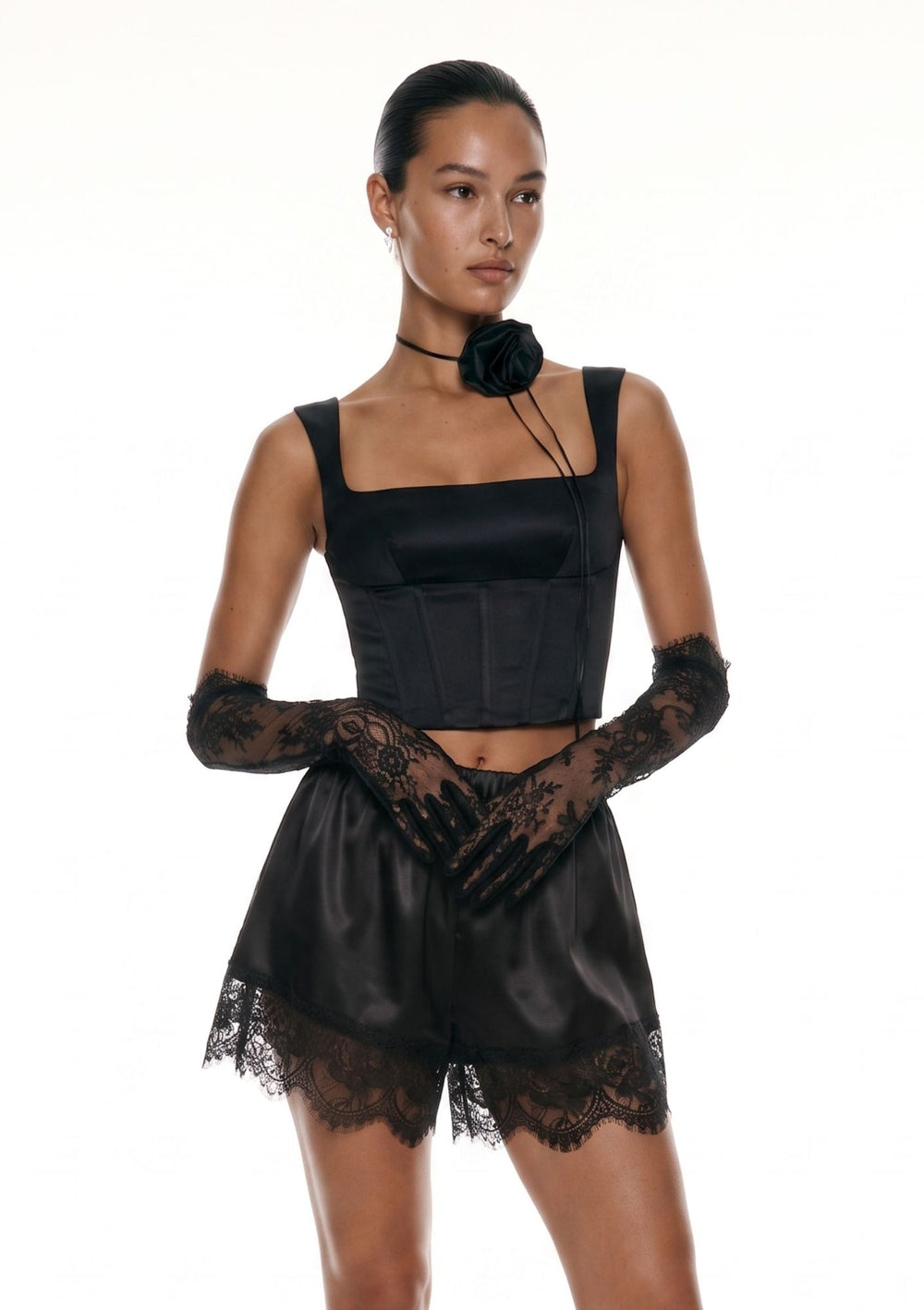 Black satin Pocker Corset with square neckline and rose choker, styled with black lace trim satin shorts and lace gloves